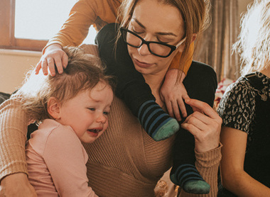 Woman sat with two children