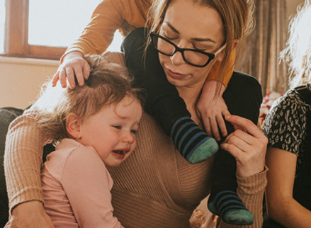 Woman sat with two children