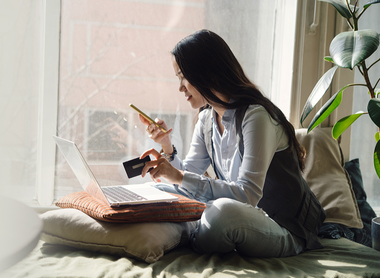 woman checking her finances on phone