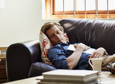 Man resting on sofa