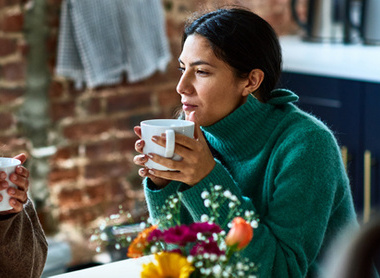 Two friends talking openly over a cup of tea