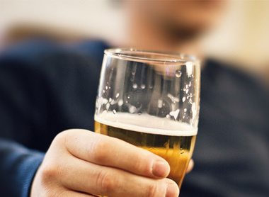 Man holding a pint of beer