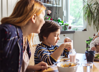 Young family around the breakfast table