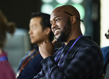 Man in audience at a conference